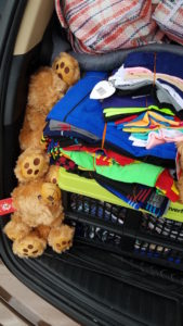 Teddy bears, clothing, and shoes for immigrant children