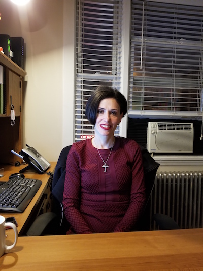 Photo of Fraidy Reiss in her office